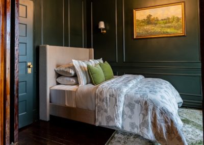 green bedroom in reed suite