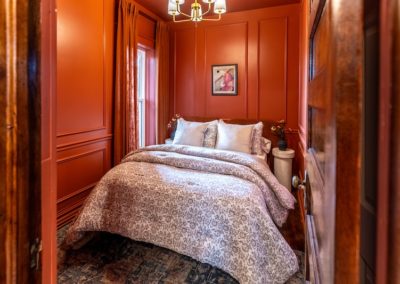 red bedroom in reed suite